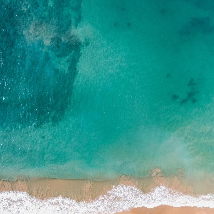 A Stunning Aerial Shot Of A Beautiful Beach In Dambulla, Sri Lanka With Clear Waters.