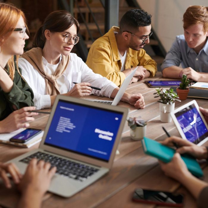 A Diverse Group Of Professionals Having A Collaborative Meeting In A Modern Office Setting.
