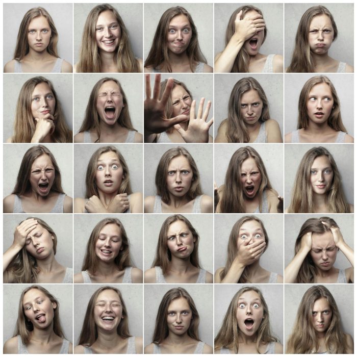Multiple Portraits Showcasing Various Facial Expressions And Emotions Of A Young Woman.