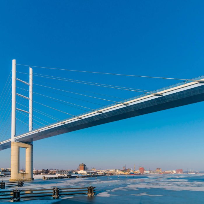 Beautiful Rügen Bridge Over Frozen Water On A Clear Winter Day In Stralsund, Germany.